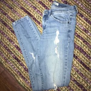Distressed light denim mid rise jeans